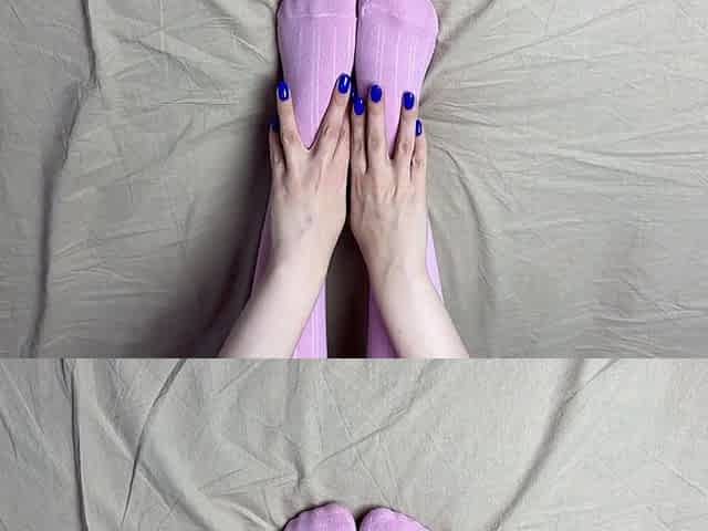 Pink socks in hands of headmistress with blue nails in solo clip