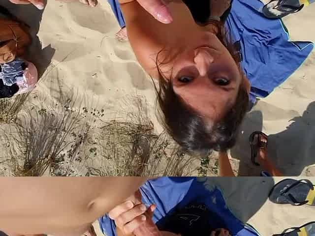 Slut at beach sucks and swallows in three-some