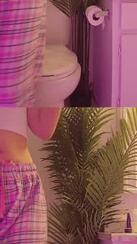 Emily pissing in the bathroom