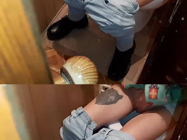 I caught a stranger masturbating on the latrine in a public restroom and we came at the same time