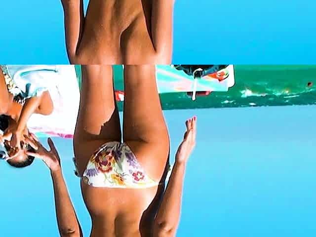Nude beach girl with an amazing ass enjoys a sunny day