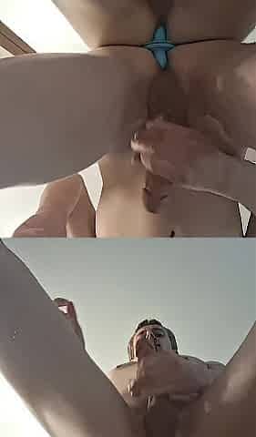 Banging a sex toy infront of the mirror at a hotel room.