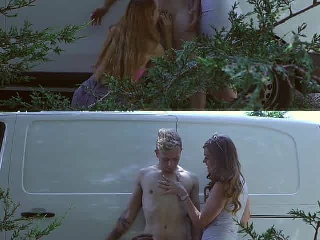 A sexy girl is showing her body to the guys in a car on the street.