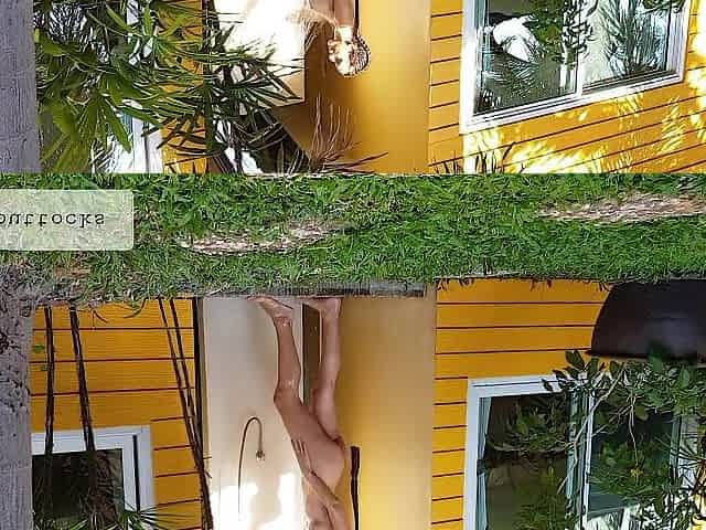 Beautiful woman takes outdoor shower and masturbates by the pool
