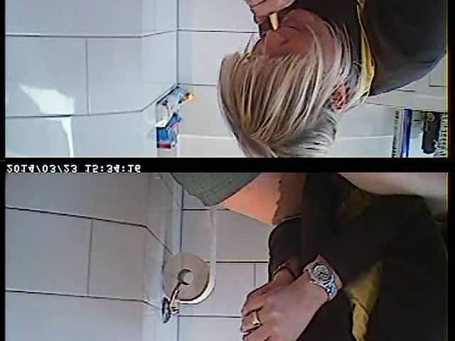 Woman being caught on hidden camera in bathroom