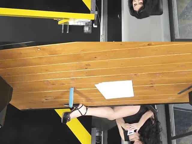 Alice Alisaki in sexy outfit, showcasing her stunning long legs in heels