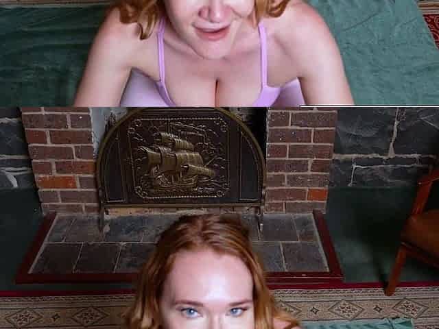 Busty redhead pulls her panties aside to finger her cunt