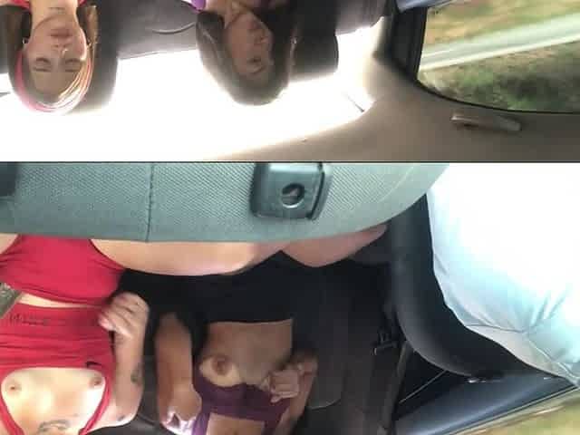 pair of gals masturbate in the car on the way home.