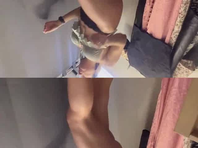 A hot woman with large bazookas and a large butt tries on clothing