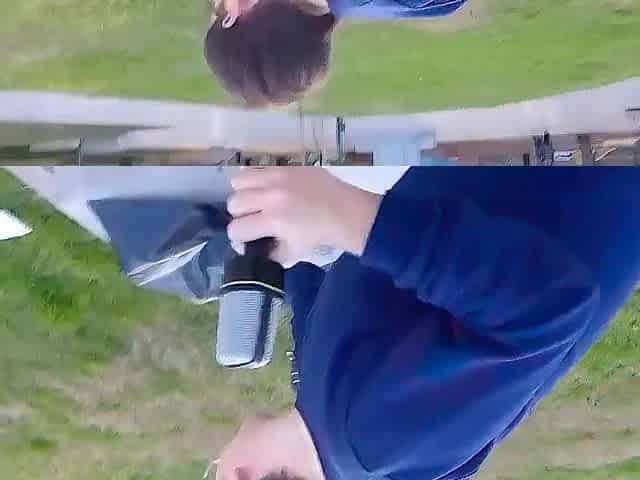 Fat busty man inserts a microphone into his anus