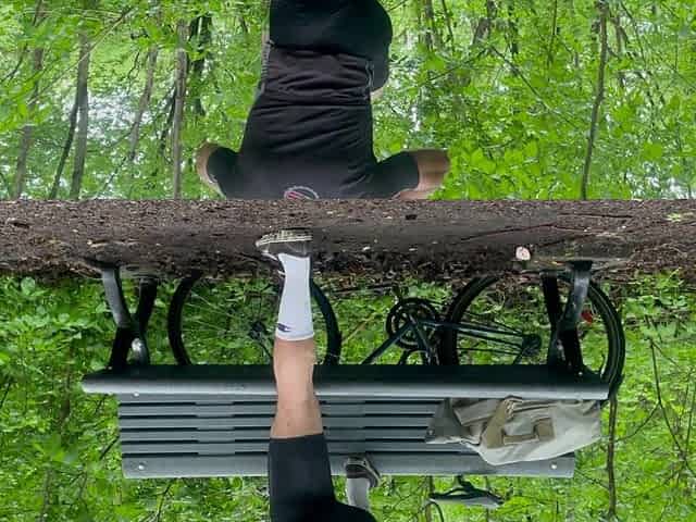 Biker In Spandex Stretching At The Park