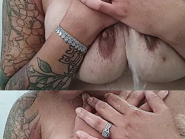 The wife soaping up her titties in the shower