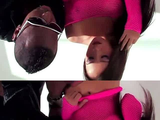 A brunette damsel gives a suck off to a dude in a bedroom