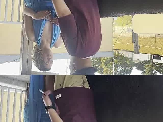Strangers making out on a balcony during the party.