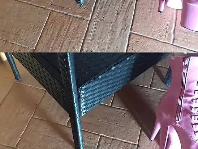 Sitting on a chair in hose and high heeled boots