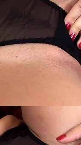 Sultry Brunette Teases Pussy with Glass Dildo on Chair