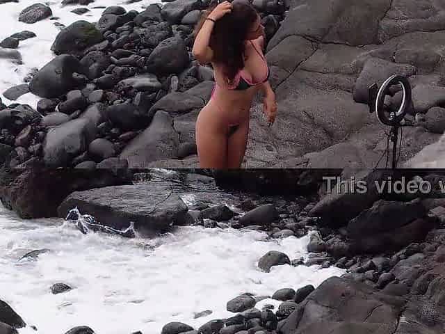 Influencer fucks on the cliffs with two hands in her ass
