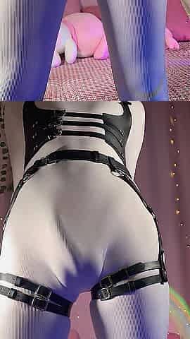 Femboy in Constricted White Bodysuit Strokes Large Rod with Belts & Harness