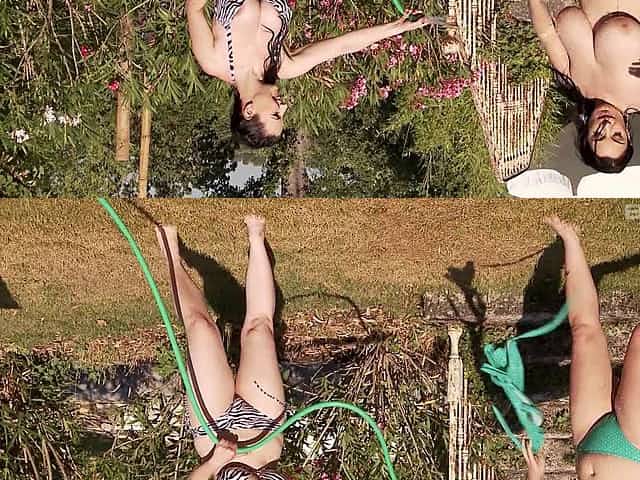Two chubby chicks washing each other's bodies in the backyard