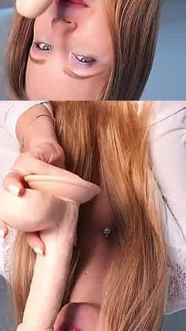 Sucking a Big Dildo While Looking at the Camera