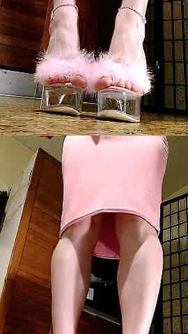 Posing in fluffy pink mules, french nails and pink tailleur