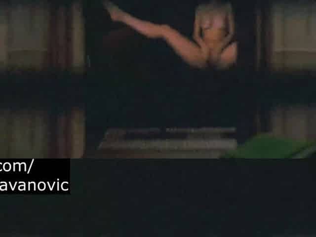 Spy Blonde Woman at the window