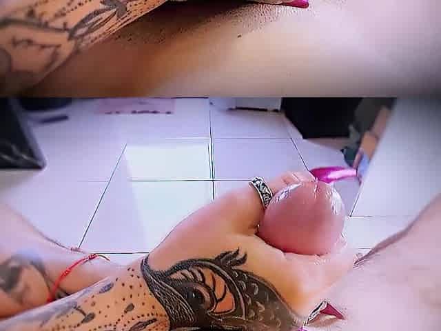 Close-up masturbation with tattooed hands and ring friction.