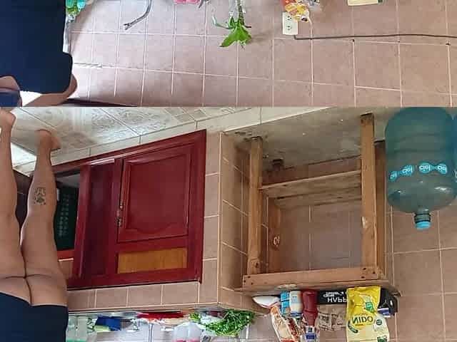 Neighbour Overweight lady in the kitchen of the apartment next door