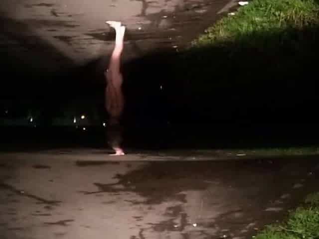 Risky in nature's garb on road with car passing