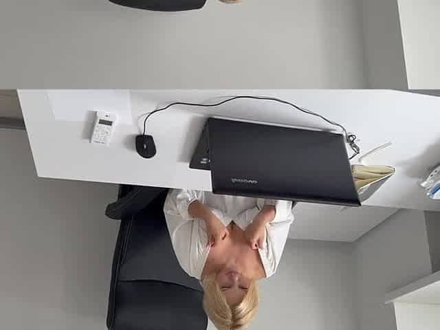 The office assistant chose to unwind after work hours by indulging in adult content at her desk.