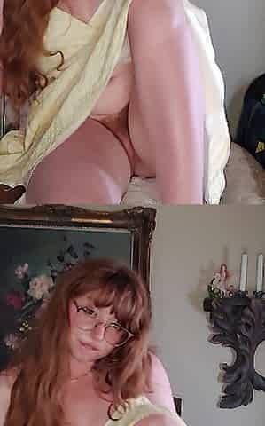 Redhead stretches pink cunt
