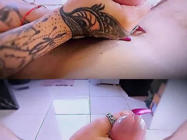 Close-up masturbation with tattooed hands and ring friction.