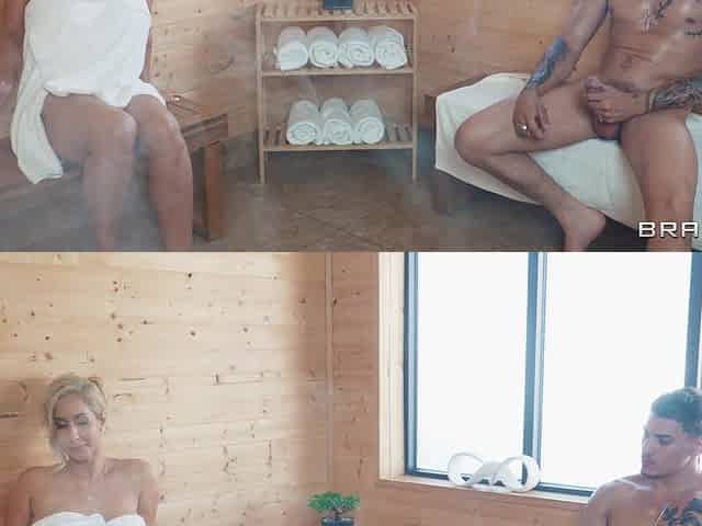 Busty Isis Love is sucking two cocks in the sauna