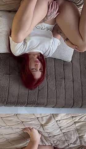A Girl Masturbates on the Bed with Her Fingers and a Vibrator and Brings Herself to Orgasm
