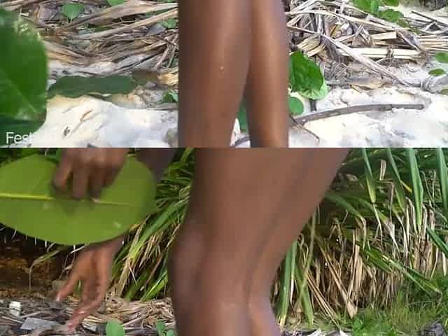 Slender Afro tribe beauty cooking medecin for her grandmother in nature's garb in forrest