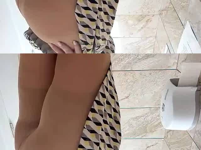 Horny Mature Woman in Pantyhose and High Heels Masturbates in a Public Toilet