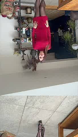 Red costume and nylons showing off cunt