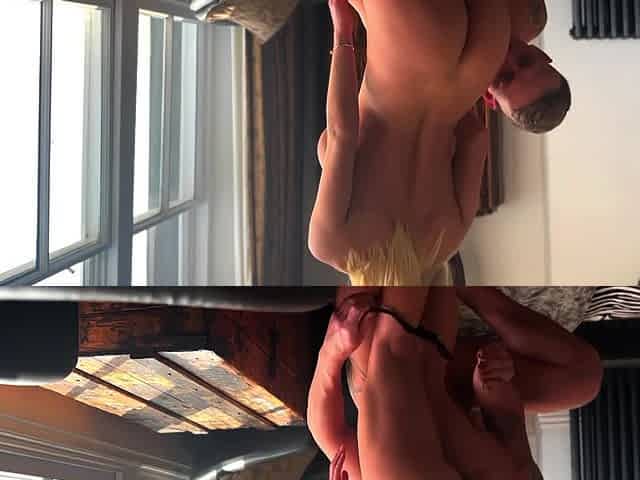 A man fucks his girlfriend with big fake tits in doggystyle