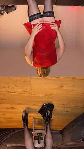 Sissy in Red Suit and ebony Sextoy ride