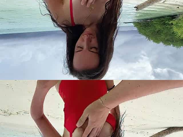 Wet oral pleasure from a breasty brunette hair on a desert island