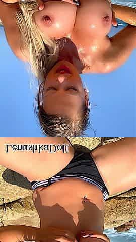 1. HAWT Lenushka Doll oils up her bazookas on the beach two. SEXY Showering