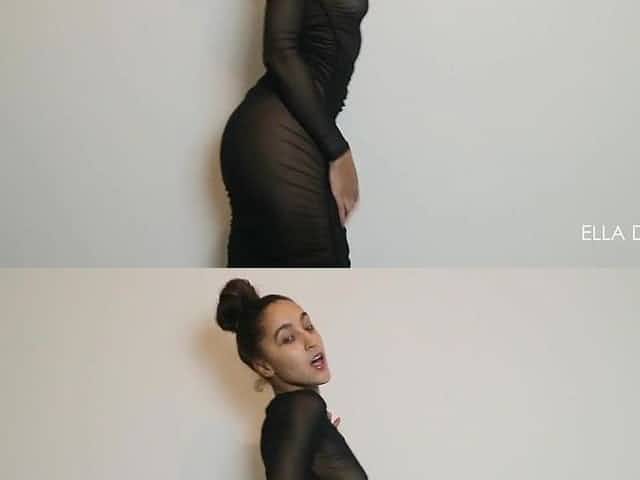 Ella Dearest teases in watch throughout ebony suit