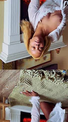 Lewd angel masturbating by the fireplace