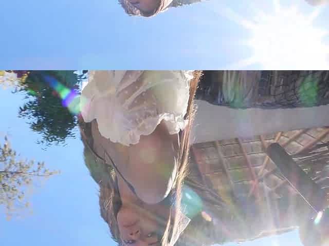 Asian MILF cowgirl poses nude at a ranch