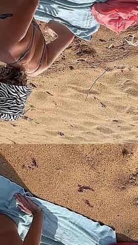 A Busty Blonde Is Walking and Sunbathing Naked