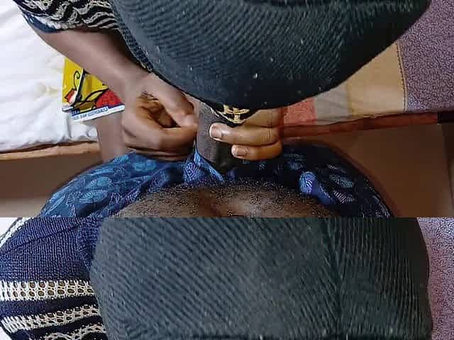 Black teen struggling to take large knob