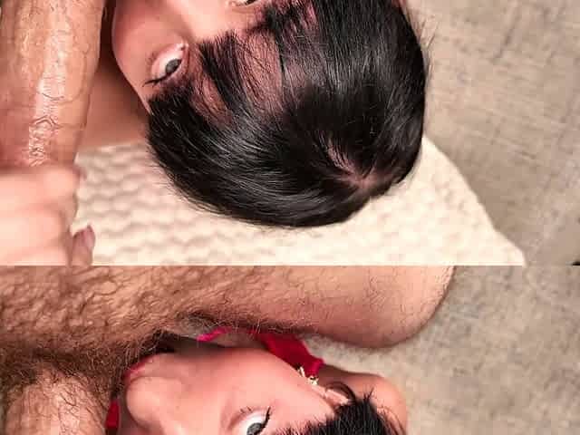 In a kitchen a sexy brunette playing with her big boobs