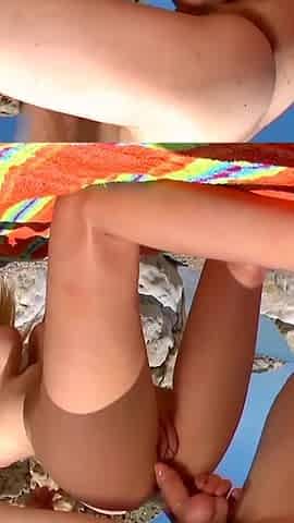 Blonde milf rides on the beach
