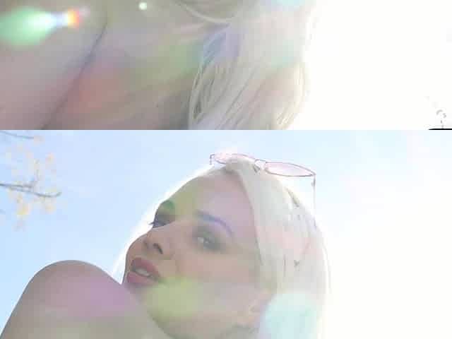 Petite tattooed blonde strips by a pool