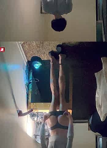 Cute femsub in short ebony petticoat playing with sex-toy